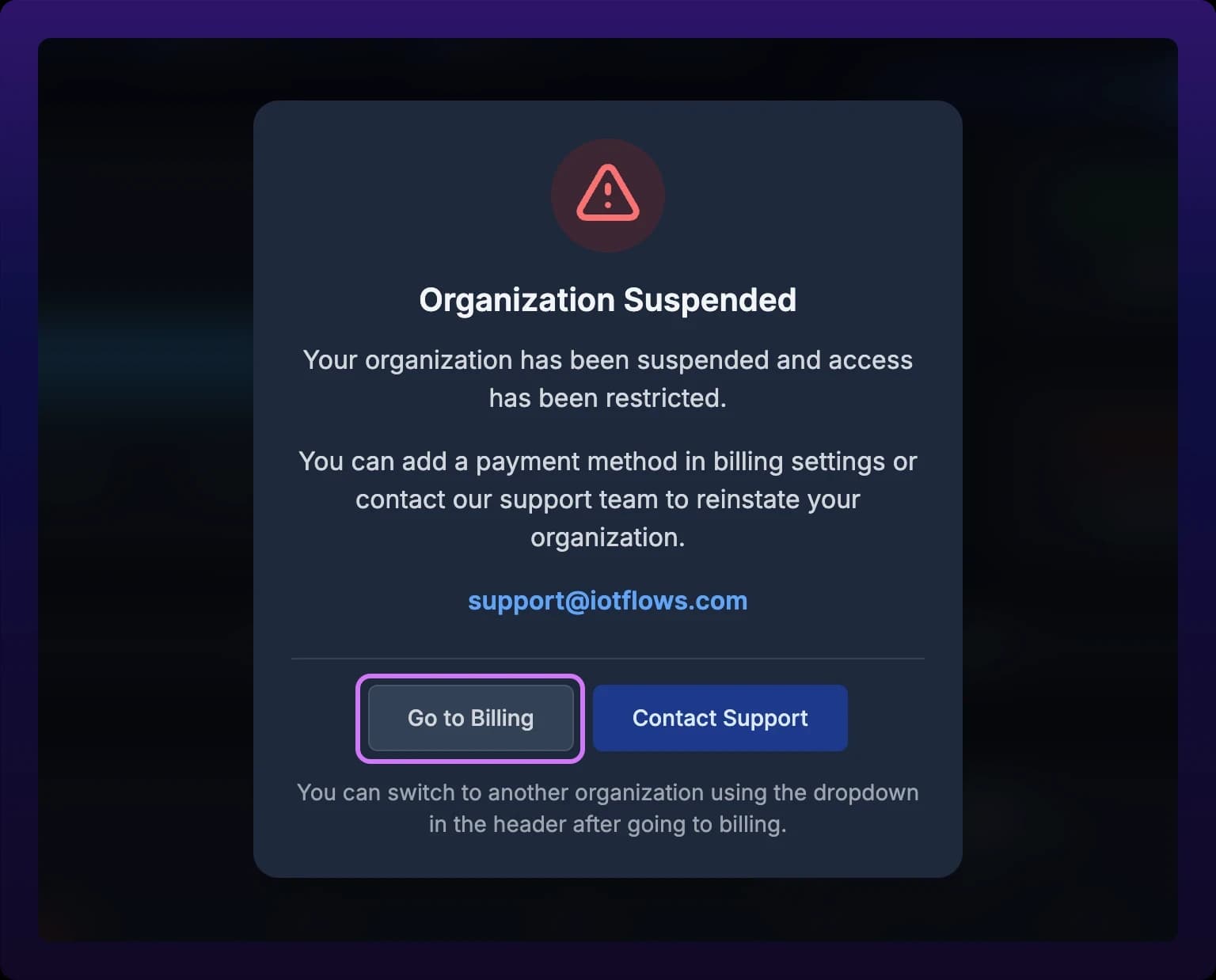 The Organization Suspended dialog centered over a blurred dashboard, with a red warning icon above the title and Go to Billing and Contact Support buttons along the bottom edge. Go to Billing is highlighted