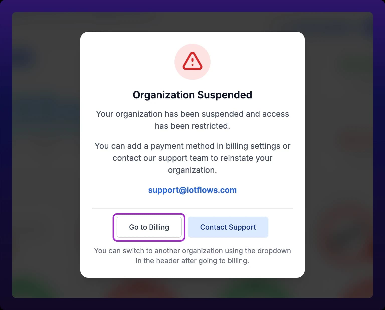 The Organization Suspended dialog centered over a blurred dashboard, with a red warning icon above the title and Go to Billing and Contact Support buttons along the bottom edge. Go to Billing is highlighted